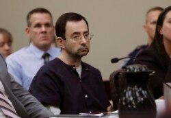 FILE - Larry Nassar sits during his sentencing hearing in Lansing, Mich., Jan. 24, 2018.
