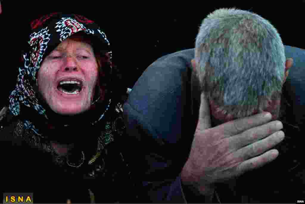 Earthquake victims mourn in the village of Varzaqan, August 12, 2012.