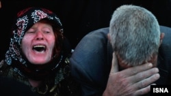 Earthquake victims mourn in the earthquake-stricken village of Varzaqan near Ahar, in East Azerbaijan province, August 12, 2012.
