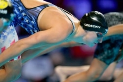 FILE - Katie Ledecky participates in the women's 800-meter freestyle during wave 2 of the U.S. Olympic Swim Trials, June 19, 2021, in Omaha, Neb.