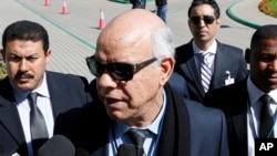 Mohammed Chouaib, head of delegation from the UN-recognized government in the eastern city of Tobruk, speaks to the media as he arrives at the Palais des Congres of Skhirate 30 km south of Rabat, March 20, 2015.