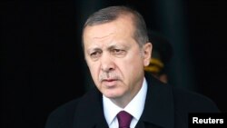 FILE - Turkey's President Tayyip Erdogan arrives for a welcoming ceremony at the Presidential Palace in Ankara, March 3, 2015. 