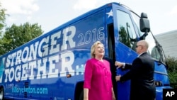 FILE - Democratic presidential candidate Hillary Clinton gets off her campaign bus as she arrives for a rally at K'NEX, a toy company in Hatfield, Pa., July 29, 2016.