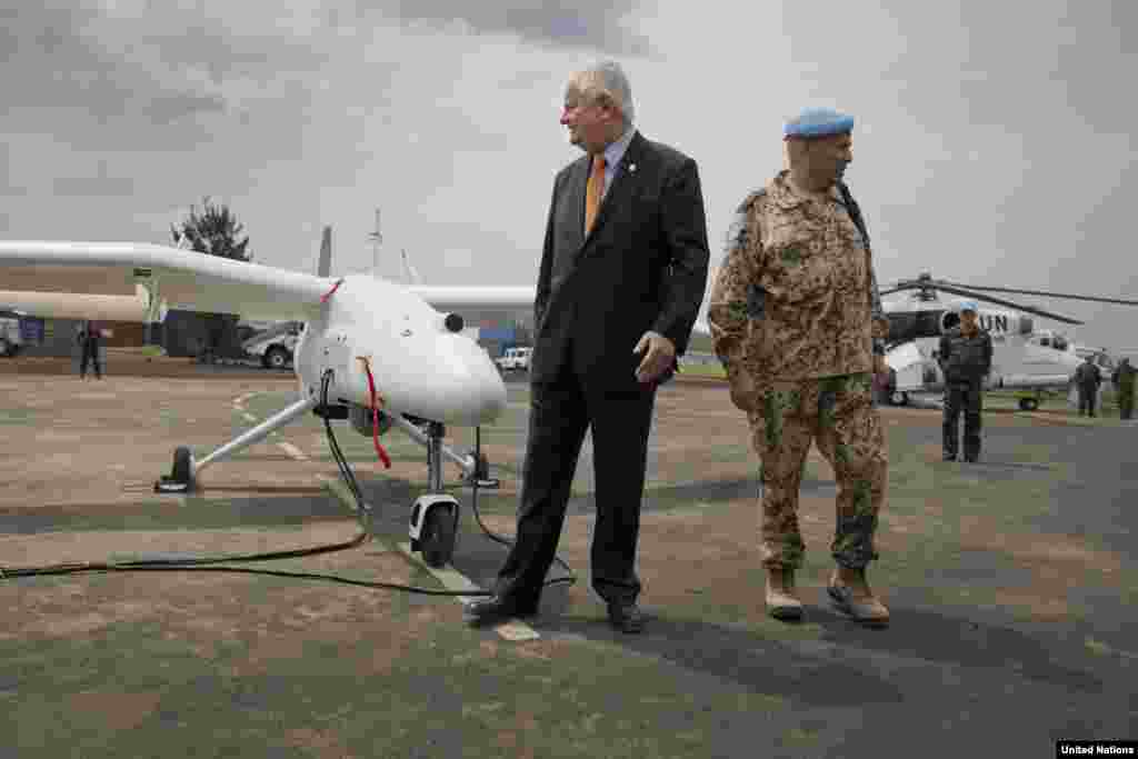 Under-Secretary-General Hervé Ladsous is given a briefing on the drones during the official launch in Goma, DRC, Dec. 3, 2013.