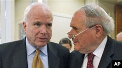 Sen. Carl Levin (R) and Senator John McCain talk about the Chinese government's failure to cooperate in an ongoing Senate Armed Services Committee investigation into counterfeit parts in the Defense Department supply chain, on Capitol Hill in Washington,
