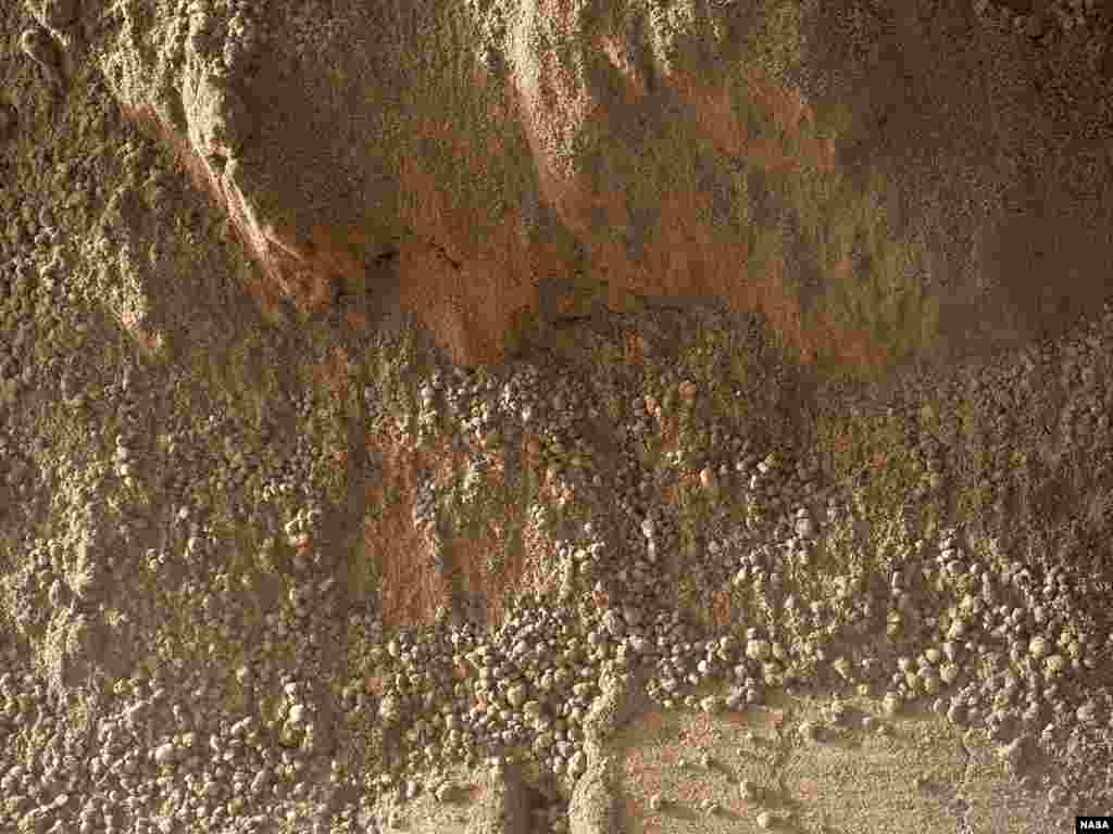 This image shows the wall of a scuff mark NASA's Curiosity made in a windblown ripple of Martian sand with its wheel.
