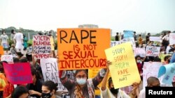 Members of a feminist group take part in an ongoing protest outside the parliamentary building, demanding justice for the alleged gang rape of a woman in Noakhali, southern district of Bangladesh, Dhaka, Oct. 10, 2020.