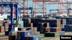 Shipping containers wait at the port of Lianyungang, China. The country's manufacturing has been slowing in recent months. The slowdown could affect Southeast Asian economies.