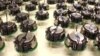 Tiny Robots Learn to Work Together