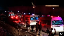 A convoy of ambulances carry Syrian citizens being evacuated from two pro-government villages of Kfarya and Foua, in Idlib provinces, Syria, July 19, 2018.
