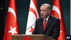 Turkey's President Recep Tayyip Erdogan speaks during a news conference, in Ankara, Turkey, Oct. 26, 2020. 