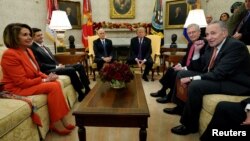 U.S. President Donald Trump and Vice President Mike Pence meet with House Democratic leader Nancy Pelosi, House Speaker Paul Ryan, Senate Majority Leader Mitch McConnell and Senate Minority Leader Chuck Schumer in the Oval Office of the White House in Washington, Dec. 7, 2017.