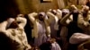 Christian pilgrims from Nigeria pray inside the Grotto of the Church of the Nativity, traditionally believed by Christians to be the birthplace of Jesus Christ, in the West Bank city of Bethlehem on Christmas Eve, Dec. 24, 2014.
