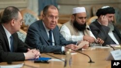 FILE - Russian Foreign Minister Sergey Lavrov, second left, speaks as he attends a conference on Afghanistan bringing together representatives of Afghan authorities and the Taliban in Moscow, Russia, Nov. 9, 2018. 