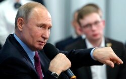 FILE - Russian President Vladimir Putin speaks during a meeting with students and researchers of an industrial college in Cherepovets, Russia, Feb. 4, 2020.