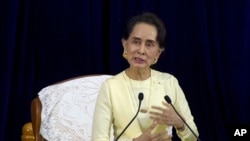 Myanmar leader Aung San Suu Kyi speaks during literacy talks with university students at the convocation hall of Yangon university Tuesday, Aug. 28, 2018, in Yangon, Myanmar.