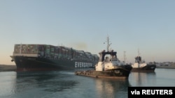 A view shows the container ship Ever Given, one of the world's largest container ships, after it was partially refloated, in Suez Canal, Egypt, March 29, 2021.
