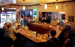 Club Ritz reopens to patrons following the Wisconsin Supreme Court's decision to strike down Governor Tony Evers' safer-at-home order against coronavirus disease (COVID-19) in Kaukana, Wisconsin, May 13, 2020.