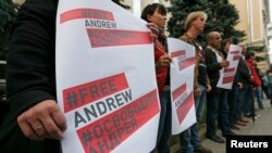 Demonstrators near the Ukraine embassy in Moscow seek information about missing Russian photographer Andrei Stenin on Aug. 26, 2014. His death was confirmed Sept. 3, 2014. 