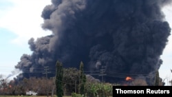 Smoke rises during a fire at Pertamina's oil refinery in Balongan, Indramayu regency, March 29, 2021.