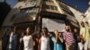 Members of "Stop Desahucios" [Stop evictions], 15M and "Afectados X la Hipoteca" [Mortgage Victims Platform] block the door of the building of Maria Jose Lopez and her husband Savador's flat, before being evicted for failing to pay their mortgage, in Mala