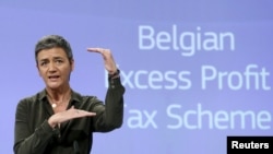FILE - Caption European Competition Commissioner Margrethe Vestager addresses a news conference in Brussels, Belgium, Jan.11, 2016, after the EU demanded Monday that Belgium recover millions of euros from 35 large companies in back taxes.