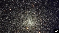 NASA's Hubble Space Telescope has uncovered the oldest burned-out stars, white dwarfs, estimated to be between 12 and 13 billion years old, inside this star cluster located 7,000 light-years away, as seen in this handout photo, date not known.