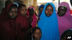 Aishat Alhaji, second from right, one of the girls abducted in February from a boarding school, is photographed after her release, in Dapchi, Nigeria, March 21, 2018.