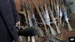 The arms, which were confiscated from the Garda World private security company are shown to media in Kabul, Afghanistan, January 5, 2012.