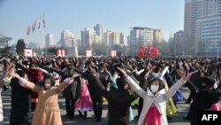 Youths and students dance as they celebrate the 74th founding anniversary of the Korean People's Army in Pyongyang, Feb. 8, 2022.