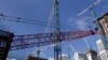 This Thursday, July 24, 2014 photo shows construction cranes at the Brickell City Centre project in downtown Miami. According to real estate license applications in 2013, the number of U.S. real estate agents is increasing as the housing market recovers from the Great Recession. (AP Photo/Lynne Sladky)