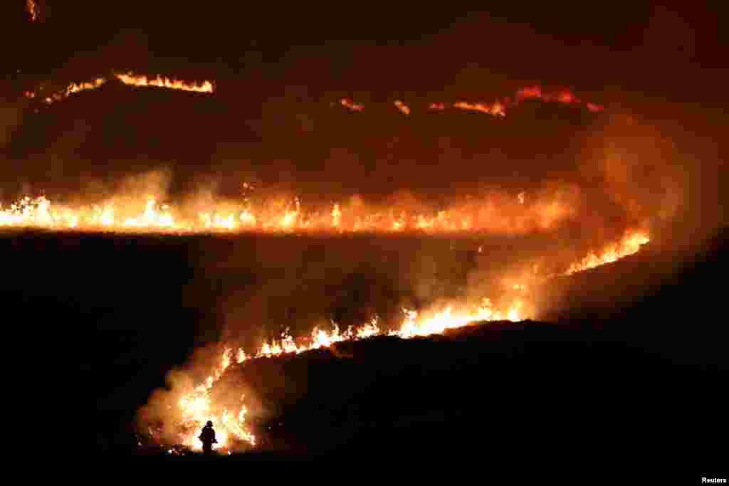 A fire is seen burning on Saddleworth Moor near the town of Diggle, Britain.