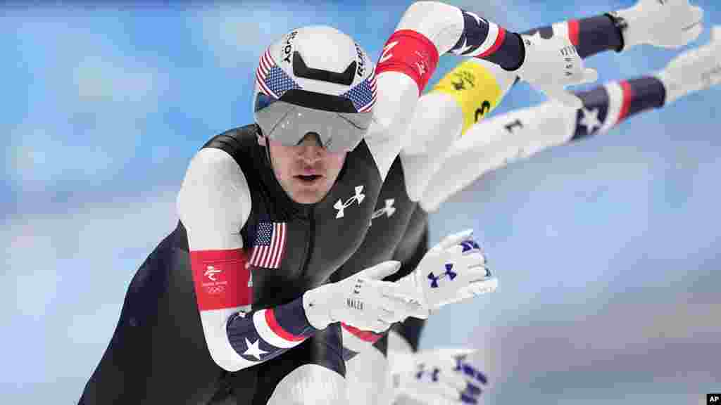 Team United States led by Casey Dawson, with Emery Lehman center and Ethan Cepuran, compete during the speedskating men's team pursuit semifinals at the 2022 Winter Olympics in Beijing.