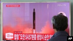 FILE - A man watches a TV screen showing a file footage of North Korea's missile launch, at the Seoul Railway Station in Seoul, South Korea, Aug. 29, 2017. 