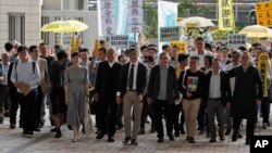 占中九子2019年4月9日抵达香港西九龙裁判法院。(右起)邵家臻、李永达、黃浩铭、戴耀廷、陈建民、朱耀明、陈淑庄、锺耀华以及张秀贤