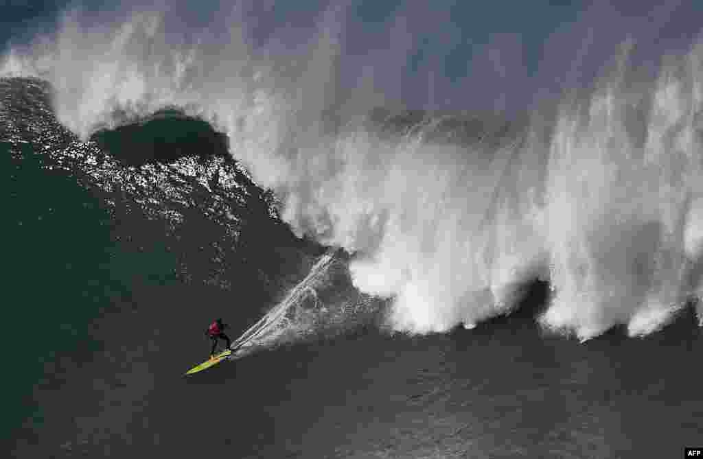 A surfer competes during the Punta Galea Challenge big wave surfing international competition in the Northern Spanish city of Getxo.
