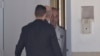 Former Israeli Prime Minister Ehud Olmert, center, enters prison to begin his sentence, in the central Israeli town of Ramle, Feb. 15, 2016.