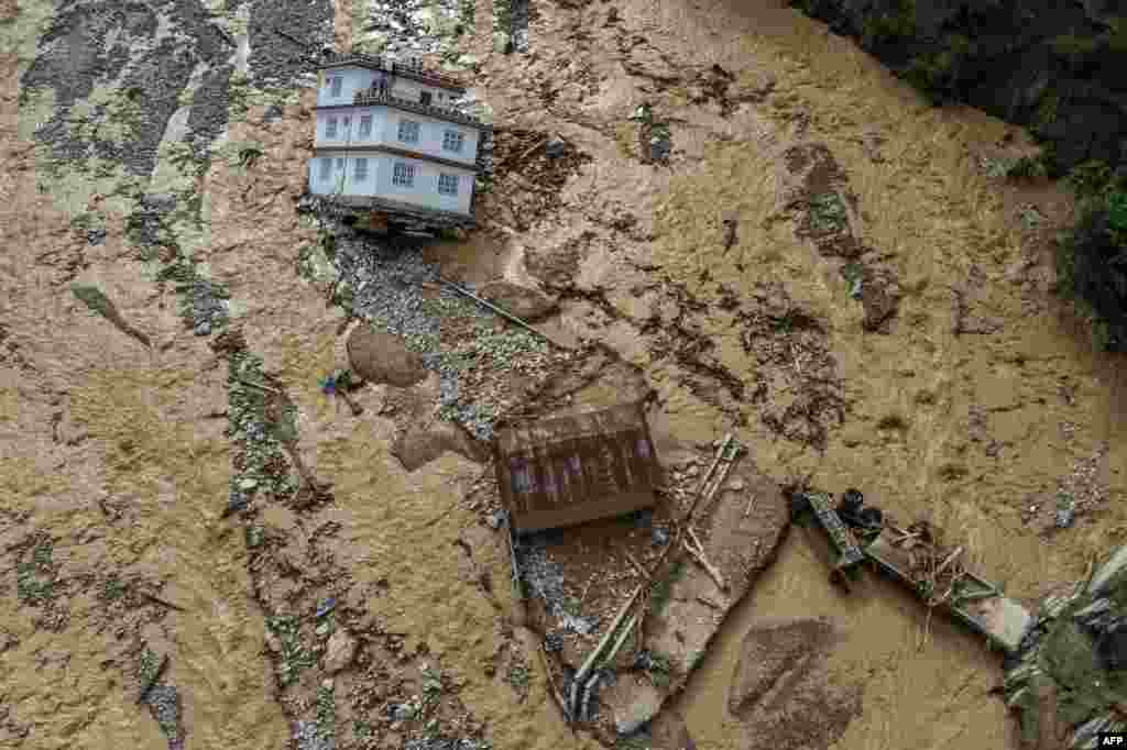 An aerial view shows the area affected by monsoon flooding in Roshi village of Nepal's Kavre district, Sept. 30, 2024. Search and rescue teams in Nepal's capital picked through wrecked homes after waters receded from monsoon floods that killed at least 209 people around the Himalayan republic. 