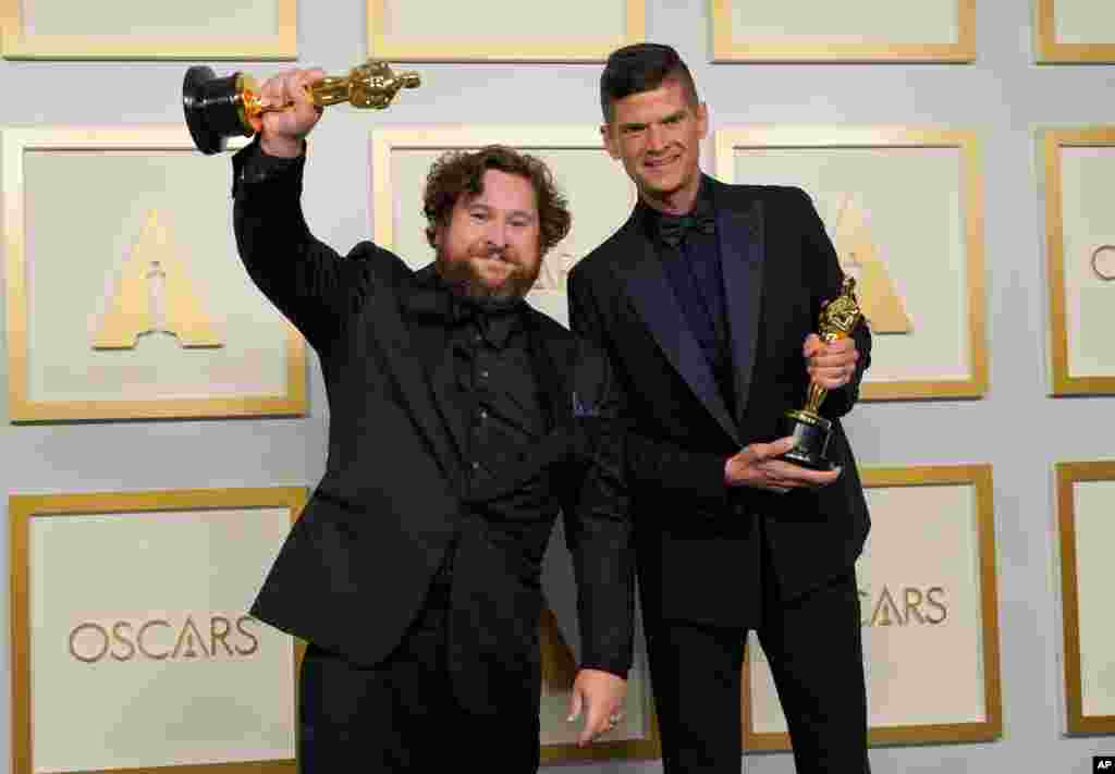Michael Govier, left, and Will McCormack pose in the press room with the award for best animated short film for "If Anything Happens I Love You" at the Oscars on Sunday, April 25, 2021, at Union Station in Los Angeles. (AP Photo/Chris Pizzello, Pool)