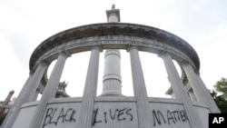 The words “Black Lives Matter” spray painted on a monument to former Confederate President Jefferson Davis in Richmond, Va., June 25, 2015.