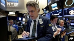 Trader Joseph Chirico works on the floor of the New York Stock Exchange, March 18, 2016. 