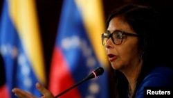 FILE - Delcy Rodriguez, president of the National Constituent Assembly talks to the media during a news conference in Caracas, Venezuela, Aug. 28, 2017.