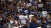 Harris promises compassion over 'fear and hate' in debut campaign rally