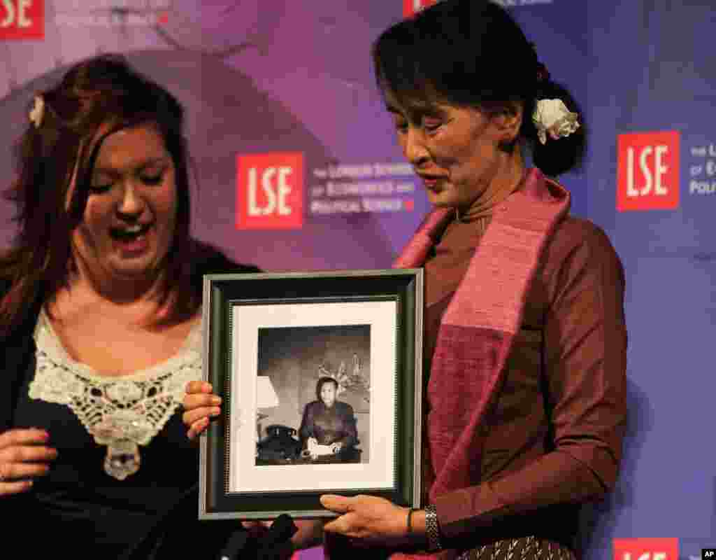 Burma's political leader is given a picture of her father for her birthday at The London School of Economics and Political Science in London, June, 19, 2012.
