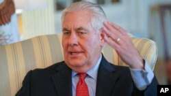 Secretary of State Rex Tillerson gestures during a interview with the Associated Press at the State Department in Washington, Jan. 5, 2018.