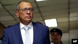 FILE - Ecuador's jailed Vice President Jorge Glas is escorted back to the courtroom for the judge's decision regarding his lawyer's habeas corpus request at the National Court, the country's highest court, in Quito, Ecuador, Oct. 15, 2017.
