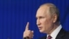 Presiden Rusia Vladimir Putin menyampaikan pidato pada Pertemuan Tahunan Klub Diskusi Valdai ke-19 di Moskow, Rusia, 27 Oktober 2022. (Foto: Sputnik/Mikhail Metze via Reuters)