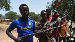 A picture taken on March 6, 2014 shows members of the Chritisian militant group Revolution of Justice (RJ) arriving in the village Nanga Boguila between Bossangoa and Bozoum. 