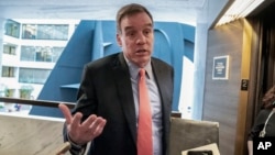 Senate Intelligence Committee Vice Chair Mark Warner, D-Va., who leads the panel with Republican Chairman Richard Burr of North Carolina, departs after a meeting at committee's secure facility on Capitol Hill in Washington, May 9, 2019.