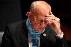 FILE - Republican Congressman Louie Gohmert studies notes during a House Judiciary Committee hearing on Capitol Hill, in Washington, July 28, 2020.
